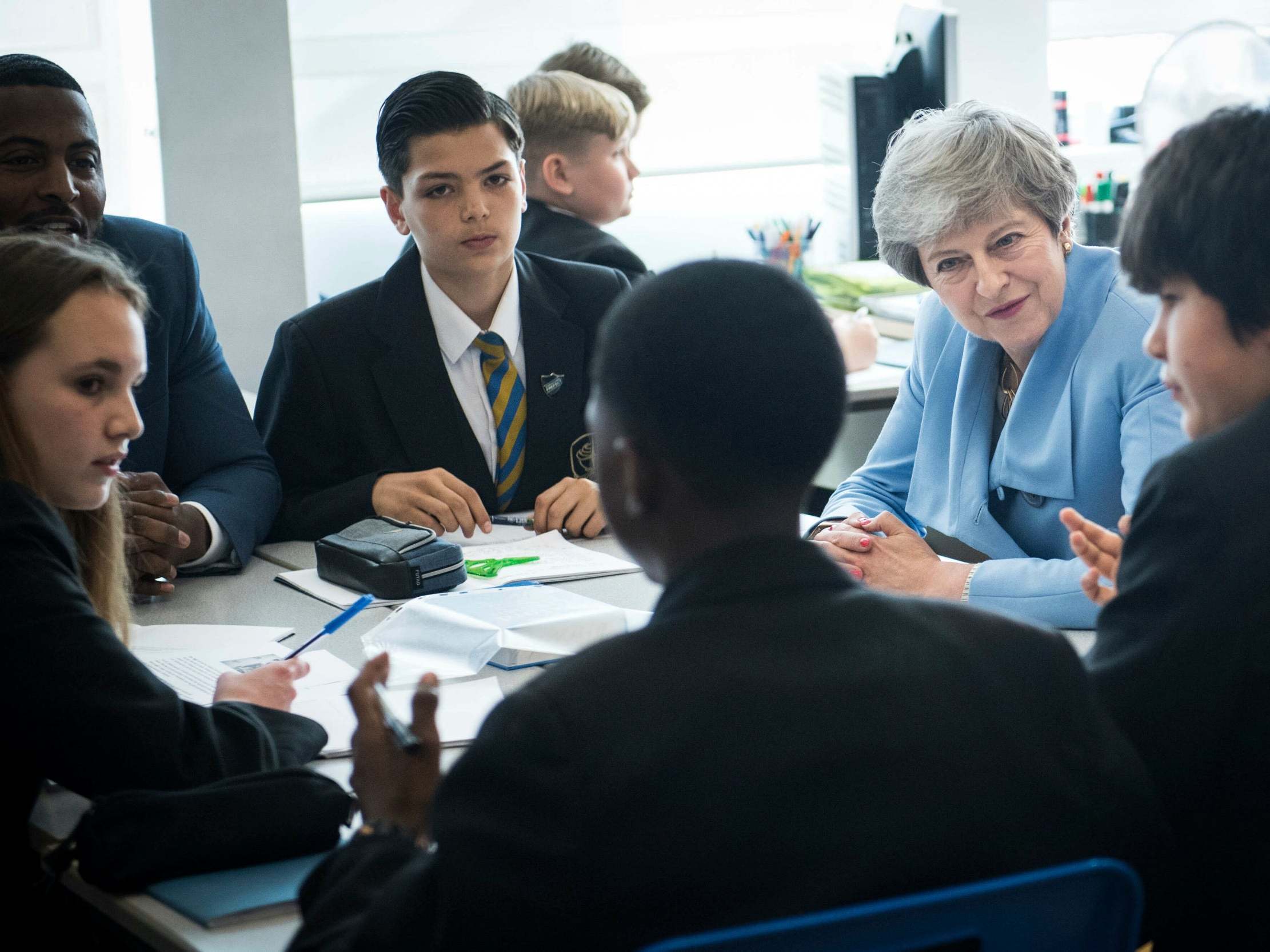 Theresa May discusses mental health with pupils at a school in London