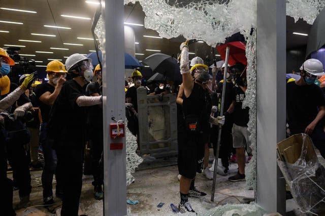Chinese state media denounced Hong Kong protesters who smashed their way into government headquarters on anniversary of city's handover from UK