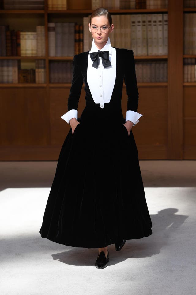 A model presents a creation by Chanel during the Women's Fall-Winter 2019/2020 Haute Couture collection fashion show at the Grand Palais turned into a giant library in Paris, on July 2, 2019.
