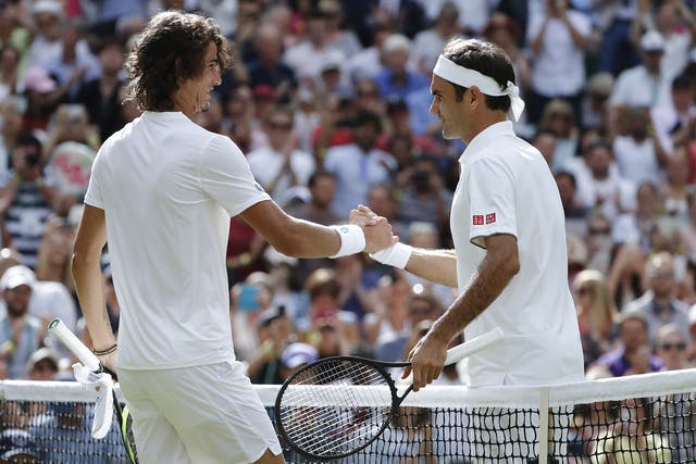 Harris and Federer shake hands at the net