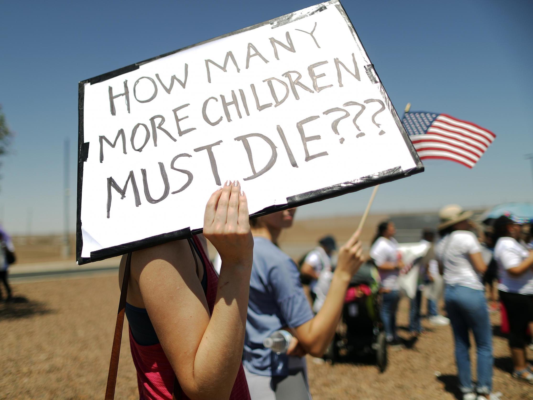 Protesters gather at Clint detention centre, where toddler Wilmer Josue Ramirez Vasquez was held before dying of complications caused by multiple diseases