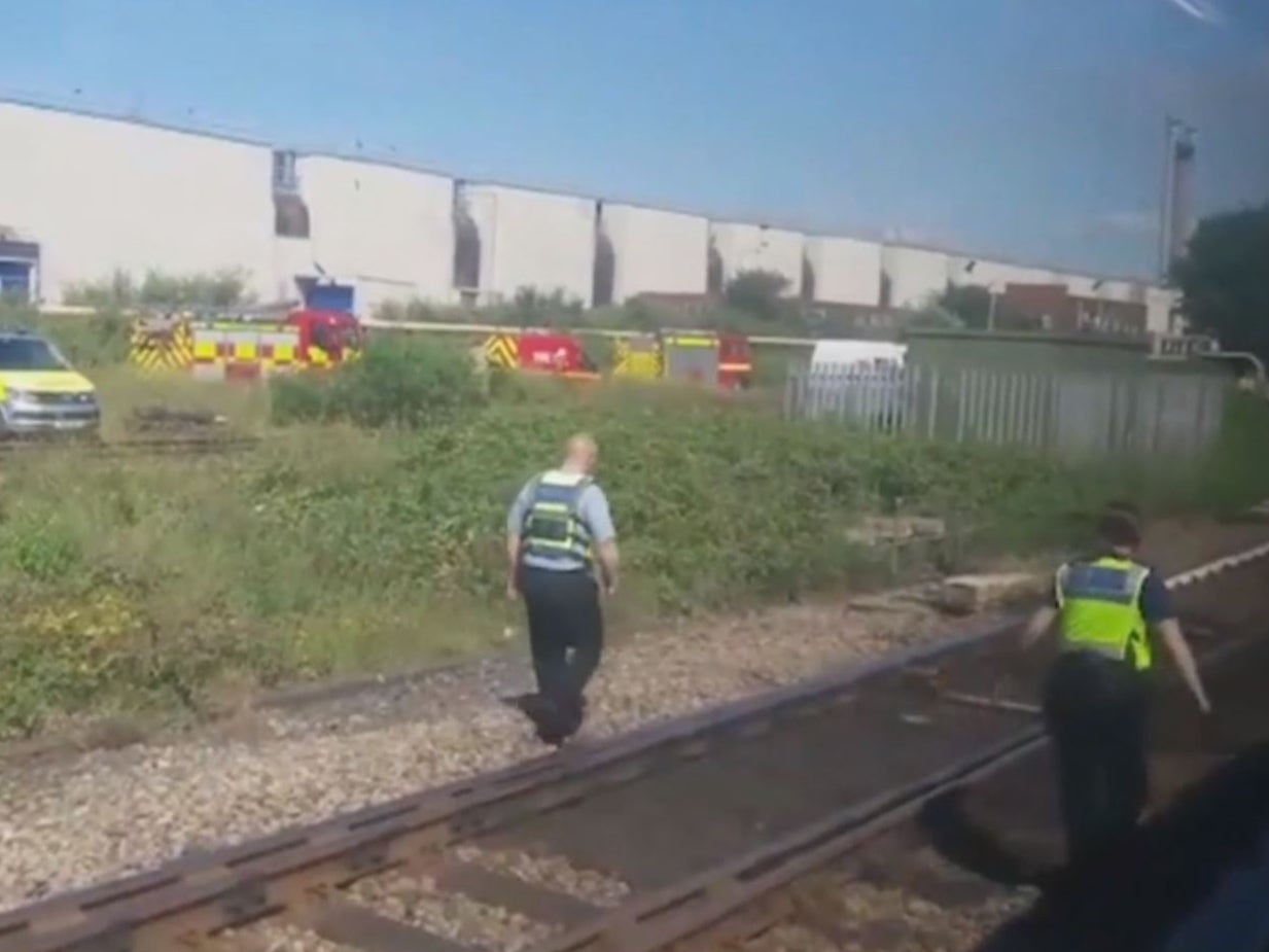 Investigators in Port Talbot, south Wales, after a train crash