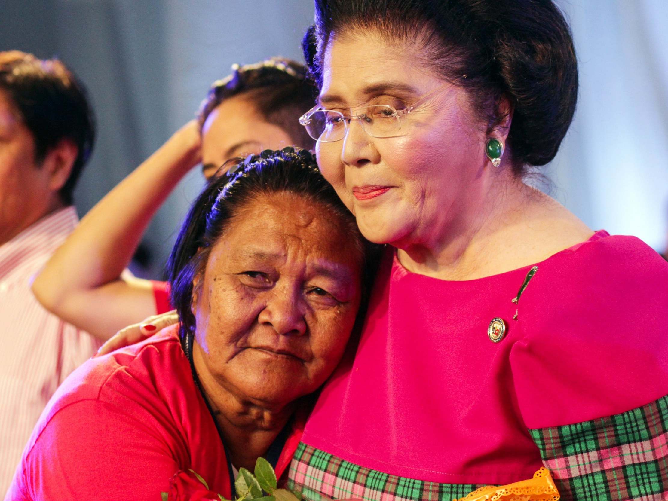 Filipino former first lady Imelda Marcos is greeted by a supporter during her 90th birthday celebration