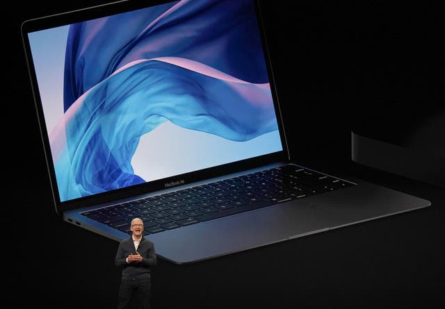 Apple CEO Tim Cook presents new products, including new Macbook laptops, during a special event at the Brooklyn Academy of Music