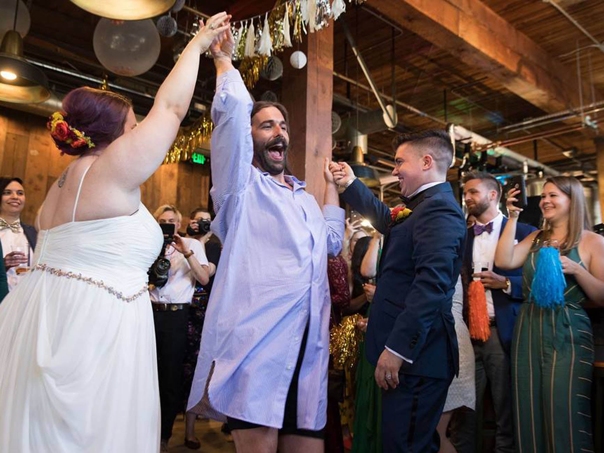 Jonathan Van Ness celebrates with newlyweds Megan and Haden at Elysian Brewing’s Capitol Hill brewpub in Seattle last month (Invision/Elysian Brewing/AP)