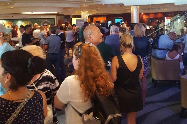 Going places? Passengers aboard Norwegian Pearl, waiting to find out what was happening