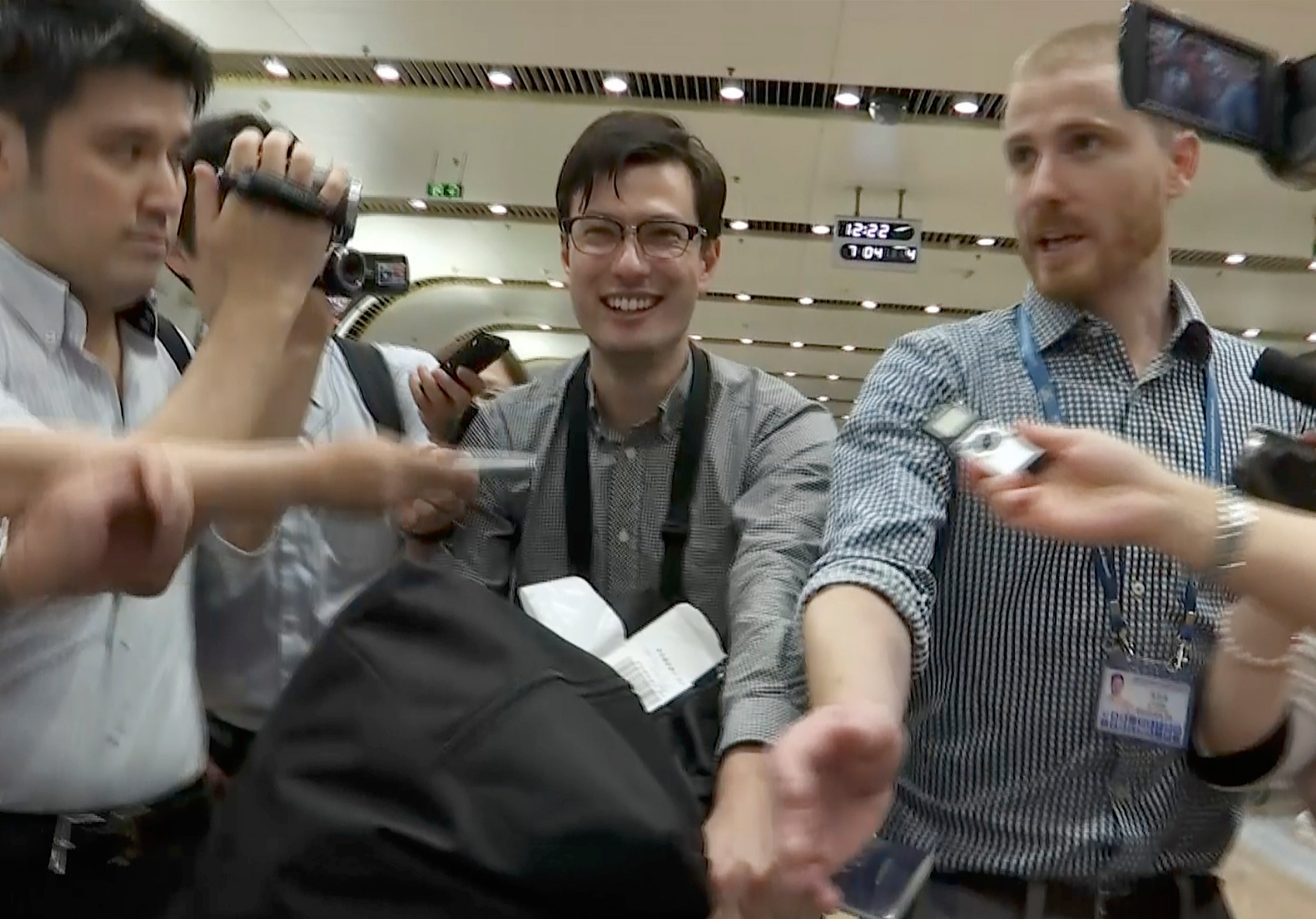 ‘Safe and well’: Alek Sigley at Beijing airport after his release
