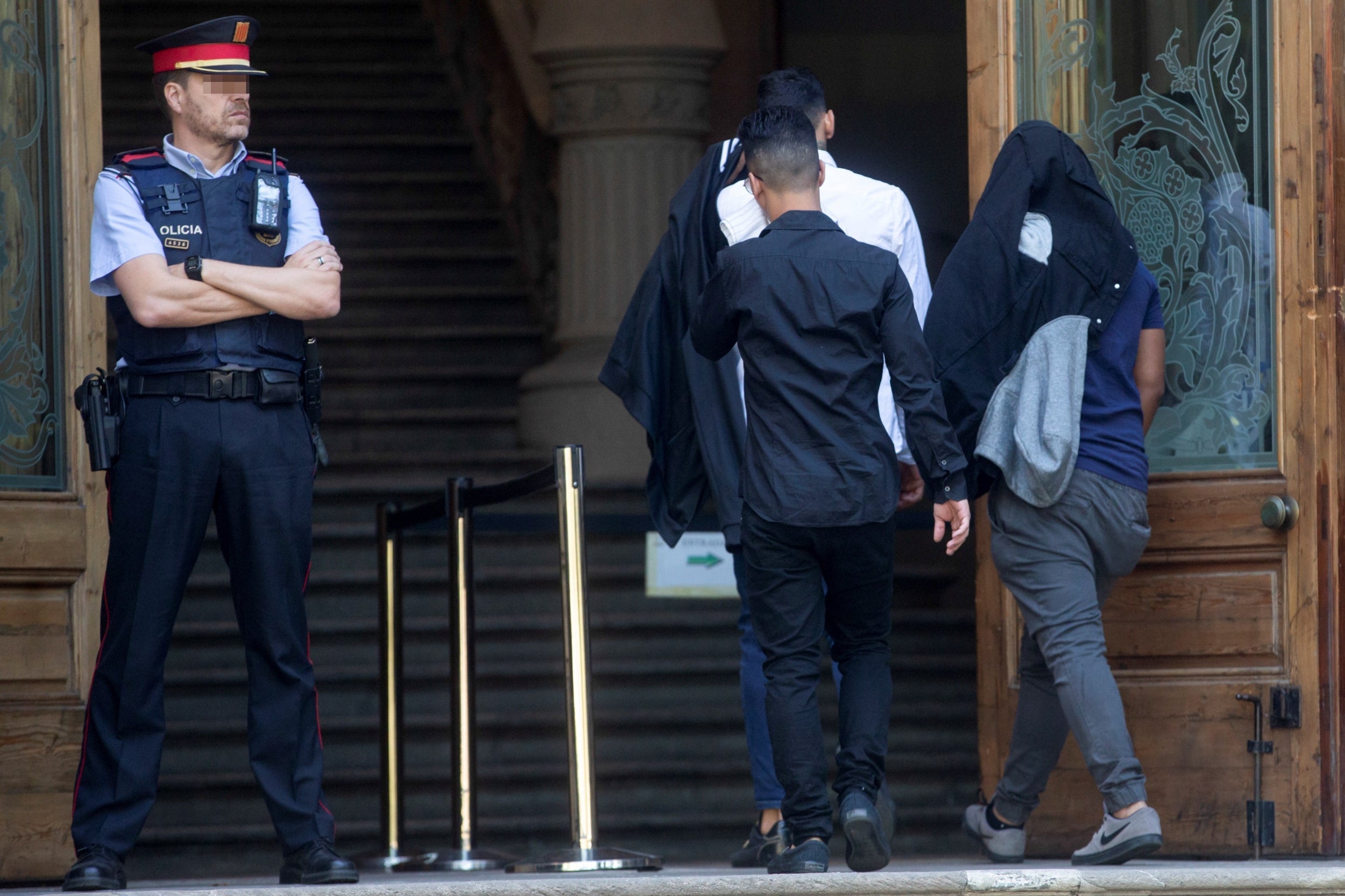 Three defendants arrive to attend a session of their trial for the alleged gang rape of a 14-years old girl