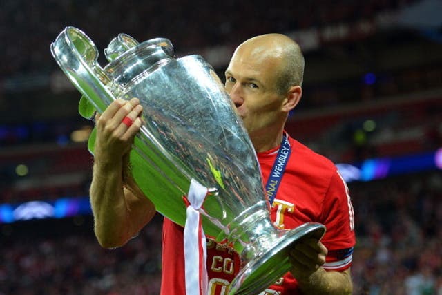 Arjen Robben celebrates with the Champions League trophy in 2013