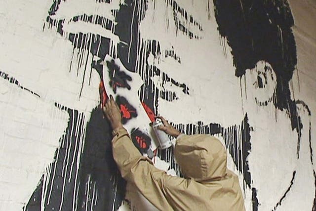 A young man claiming to be Banksy works on a piece since attributed to the mysterious artist during a recently uncovered ITV interview from 2003