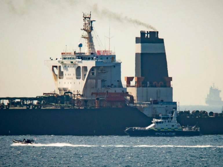 A Royal Marine patrol vessel in front of the Grace 1 super tanker in the British territory of Gibraltar