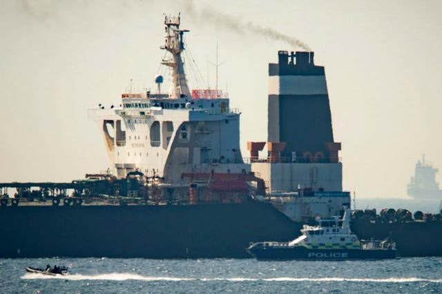 A Royal Marine patrol vessel in front of the Grace 1 super tanker in the British territory of Gibraltar