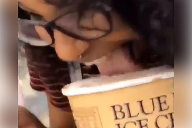 A woman was filmed licking a tub of ice cream and putting it back in a supermarket freezer