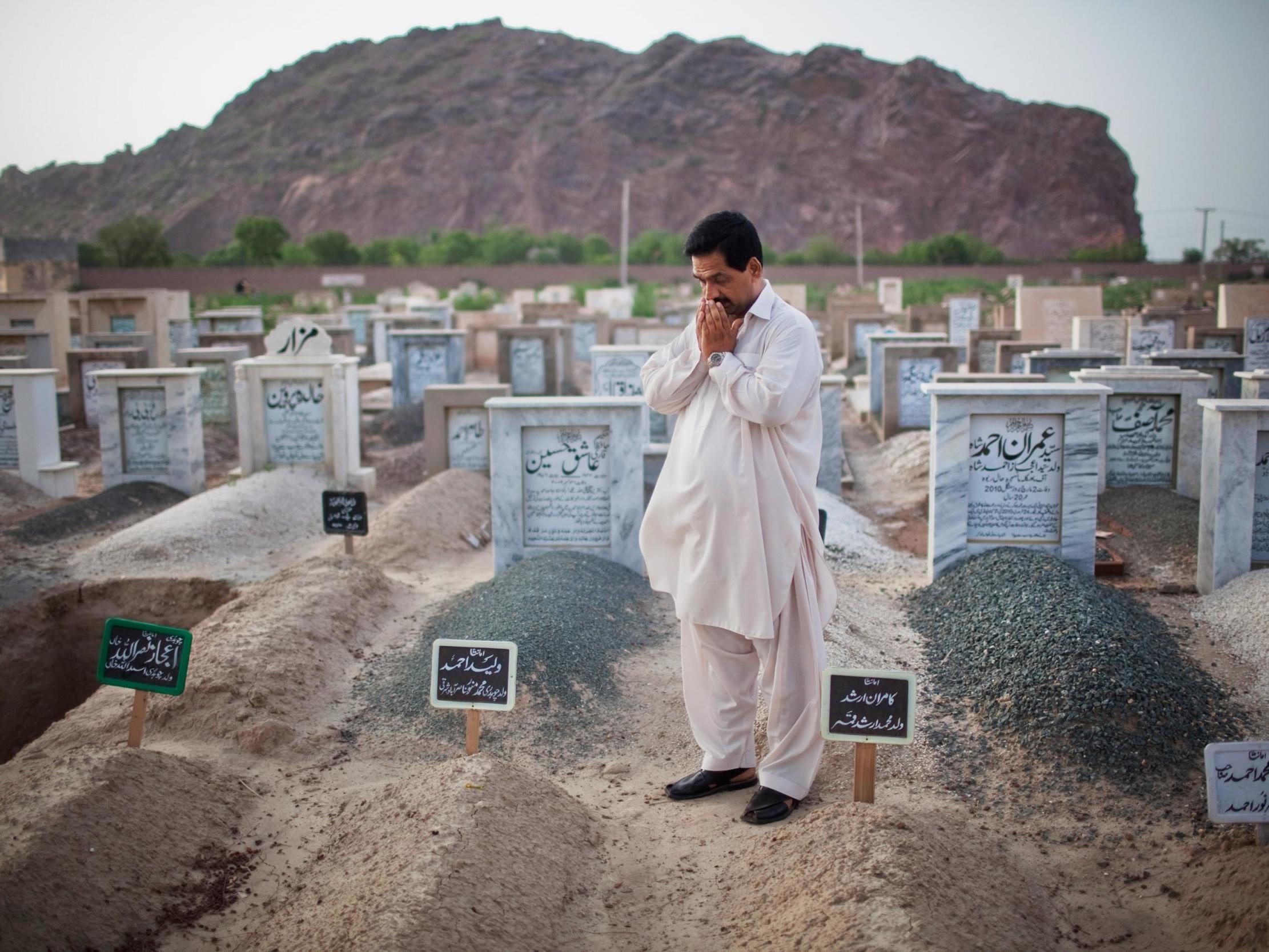 Ahmadis are not allowed to be buried in Muslim graveyards in the country; the bodies are exhumed if found (Getty)