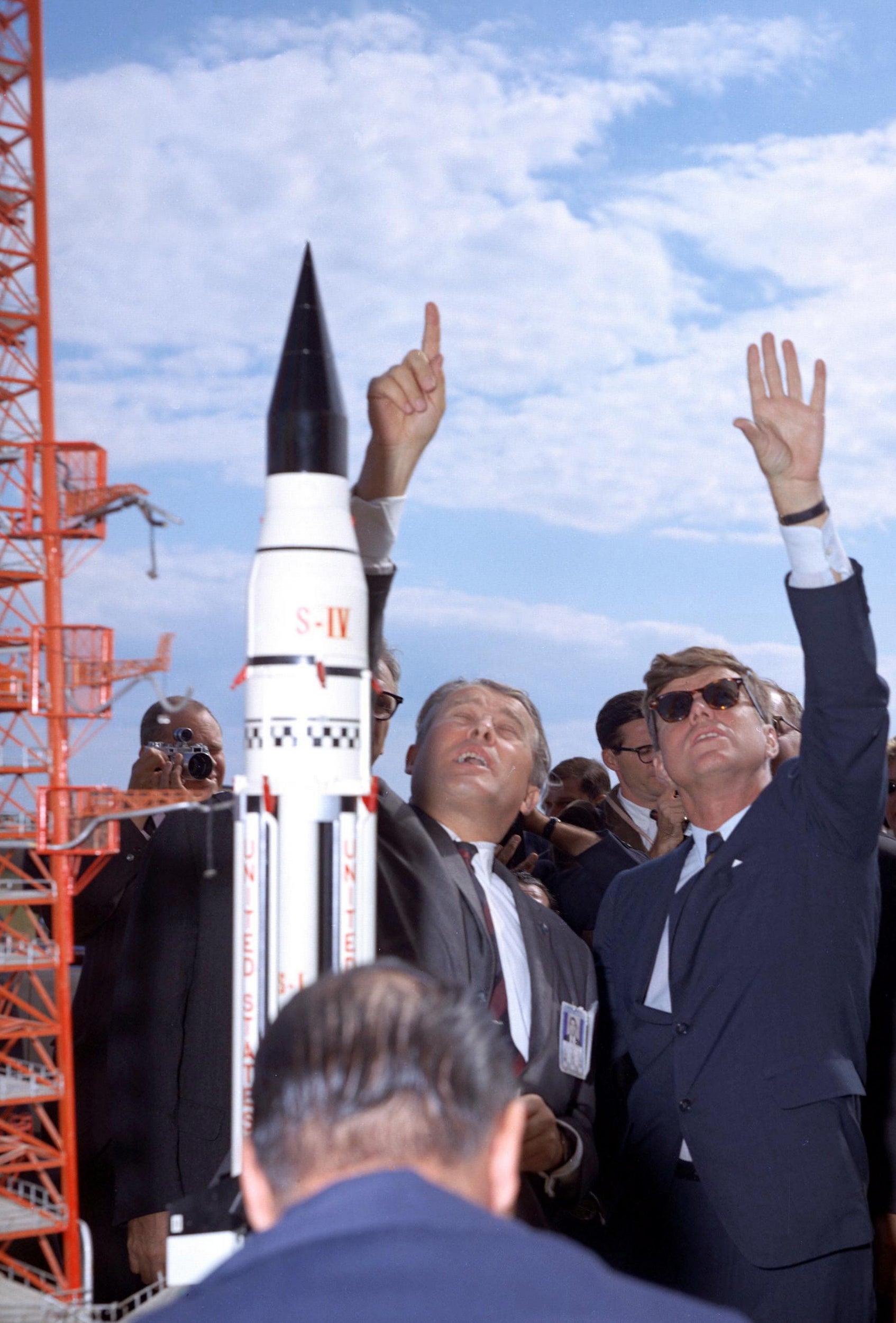 Wernher von Braun (centre) explains the Saturn rocket system to President John F Kennedy at Launch Complex 37 while the president tours the Cape Canaveral Missile Test Annex, on 16 November 1963