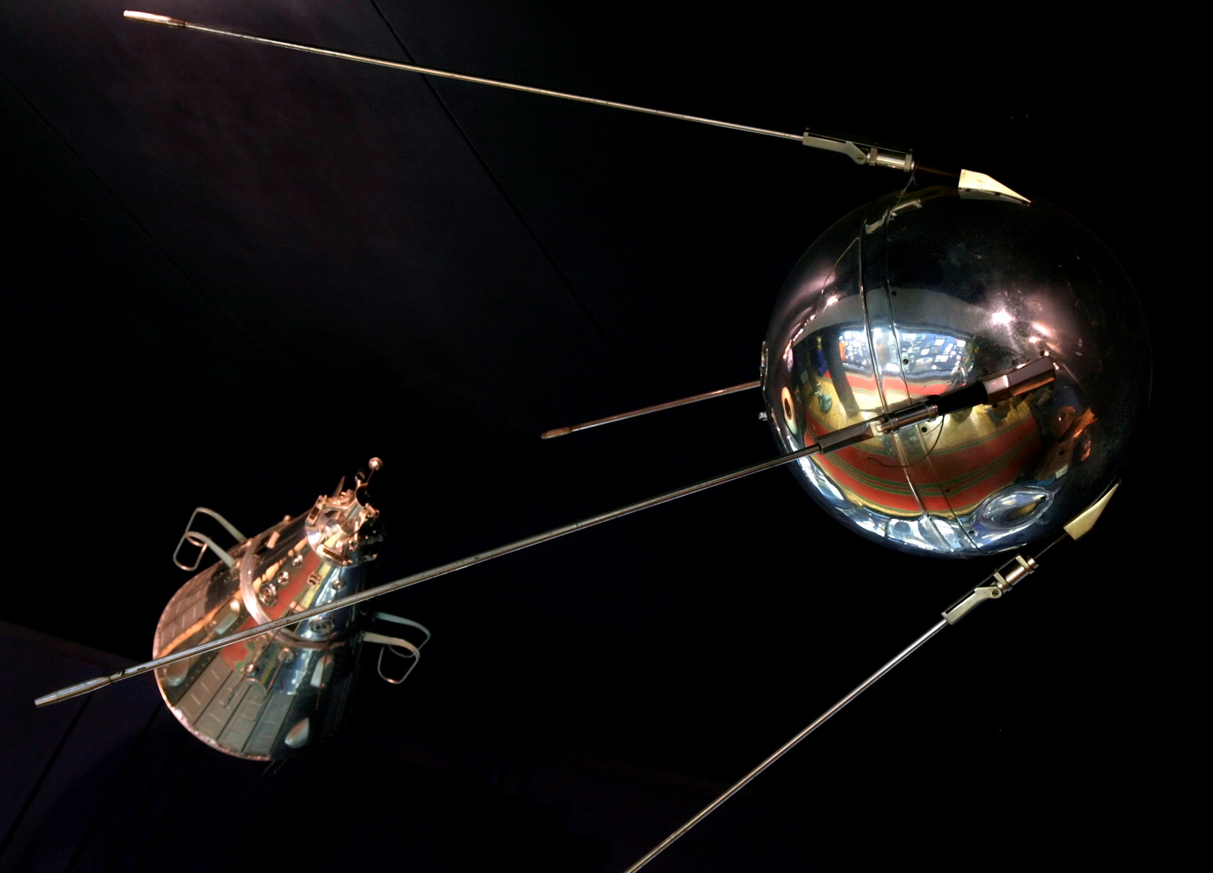 A back-up copy of the first Russian Sputnik (satellite, right), and a small replica of the second Russian satellite displayed in a small museum in the cosmonaut training centre in Star City outside Moscow. The second satellite was launched just a month later on 3 November 1957 with dog Laika on board.