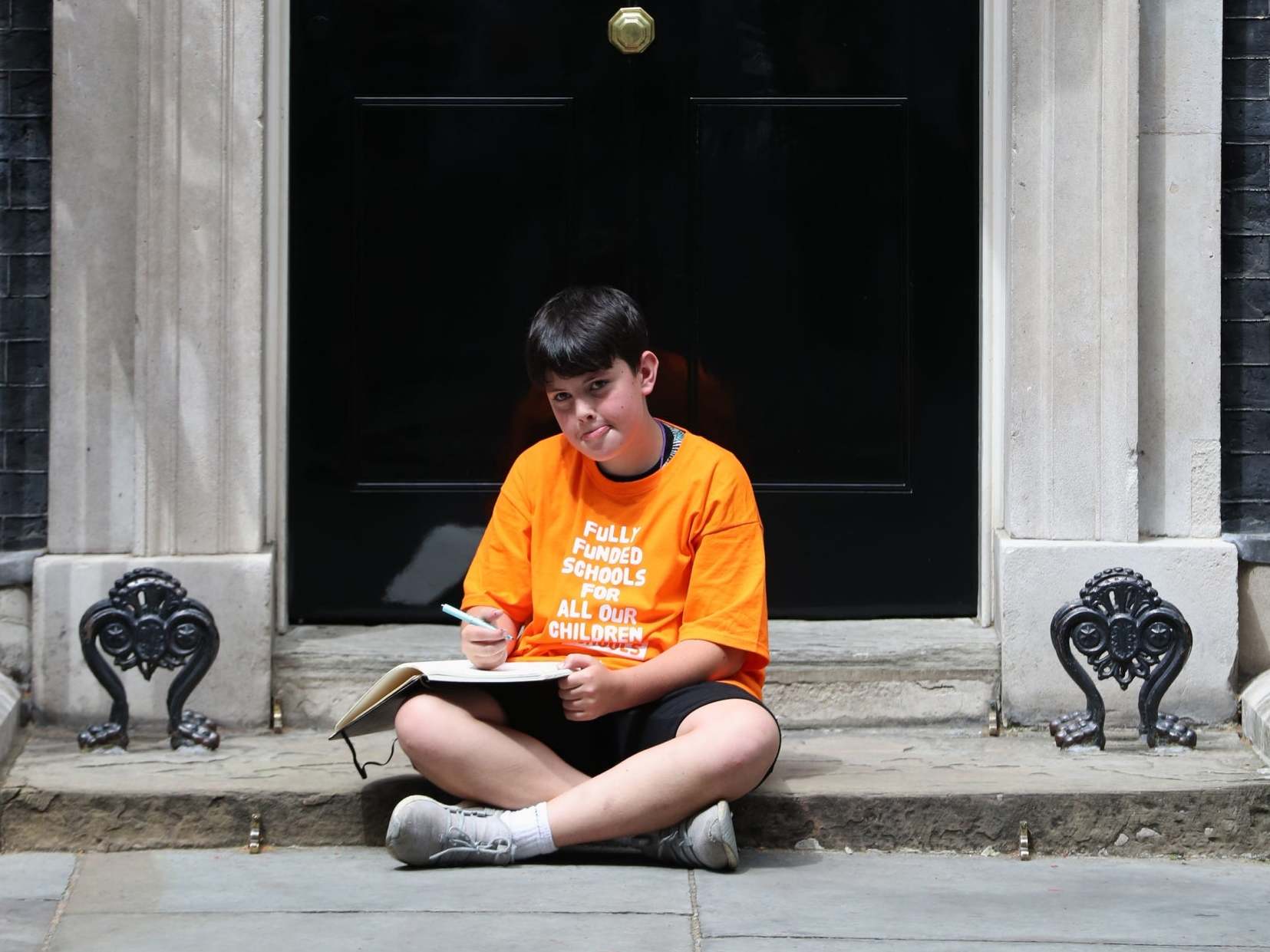 Danny, Jess Phillips’s son, on the steps of Downing Street after he was left there by his mother as a symbol of protest