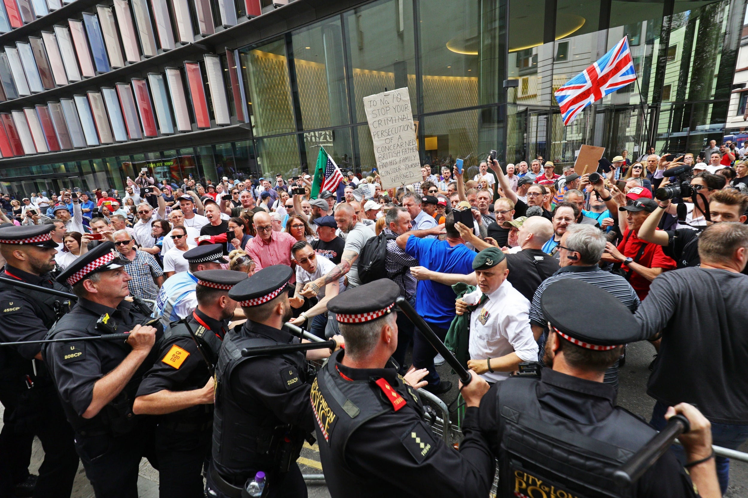 Supporters of Tommy Robinson clash with police outside the Old Bailey after he was found guilty of contempt of court