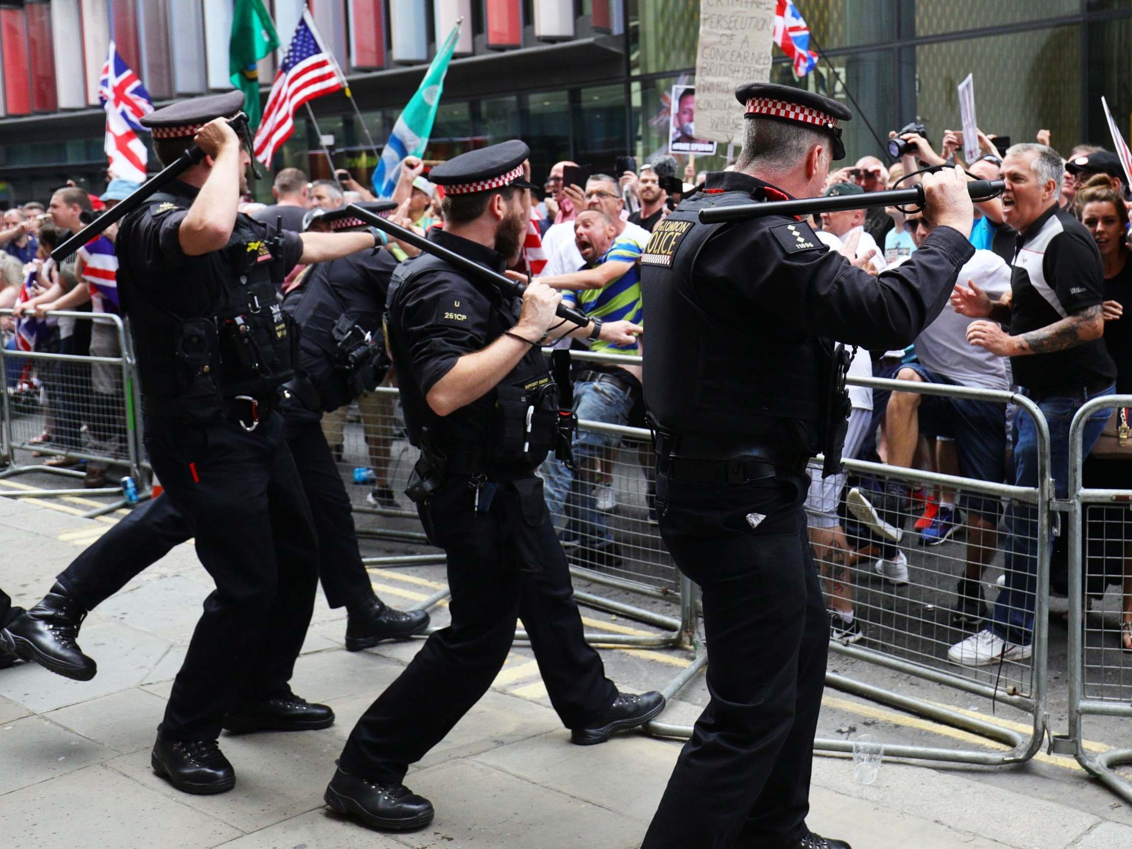 Robinson supporters clash with police outside the Old Bailey in London after the former EDL leader was found in contempt of court by High Court judges on 5 July (PA)