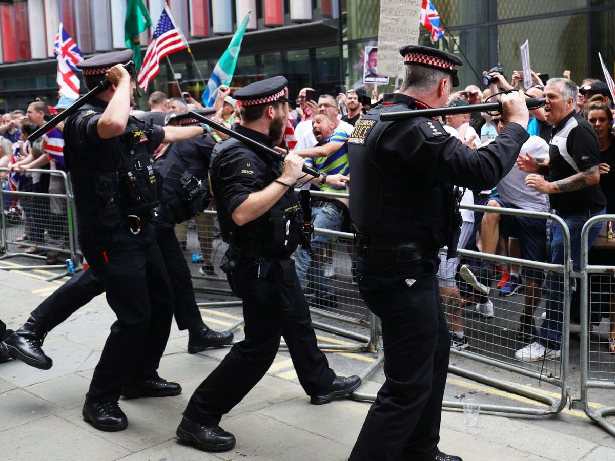 Tommy Robinson supporters hurl beer cans at journalists as tensions flare over judge’s decision