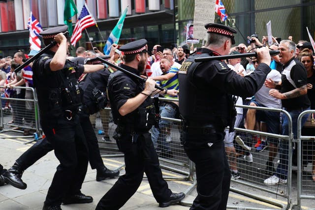 Supporters of Tommy Robinson clash with police outside the Old Bailey in London after the former EDL leader was found in contempt of court by High Court judges on 5 July 2019.