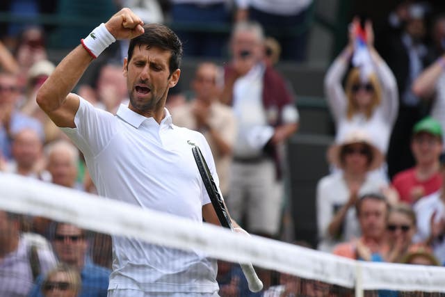 Novak Djokovic celebrates after coming through his third round match at Wimbledon