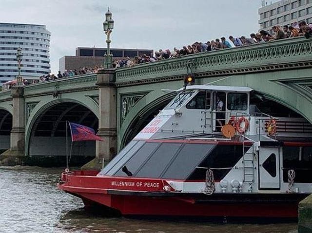 Millennium of Peace pleasure boat stuck under central London bridge