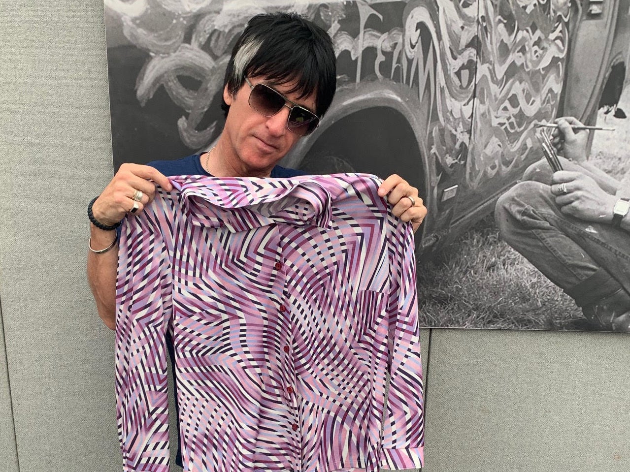 Johnny Marr has donated a purple shirt with a psychedelic print