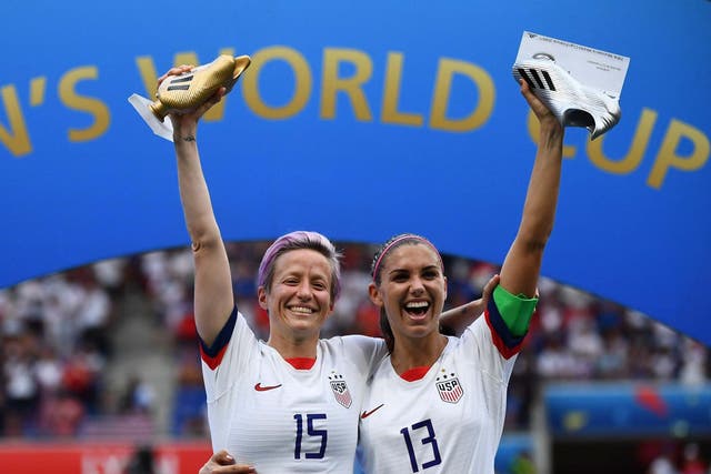 United States' forward Megan Rapinoe poses with the Golden Boot