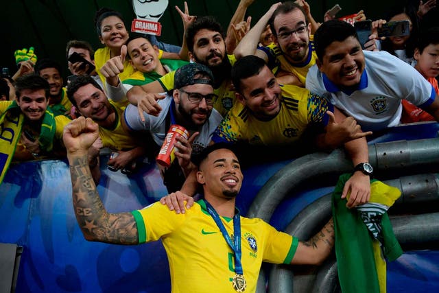 Brazil's Gabriel Jesus poses with fans