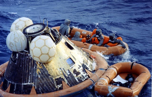 Astronauts Neil A. Armstrong, Michael Collins And Edwin E. Aldrin Jr. After Getting Into The Life Raft During Recovery Operations Today At The Completion Of Their Successful Lunar Landing Mission
