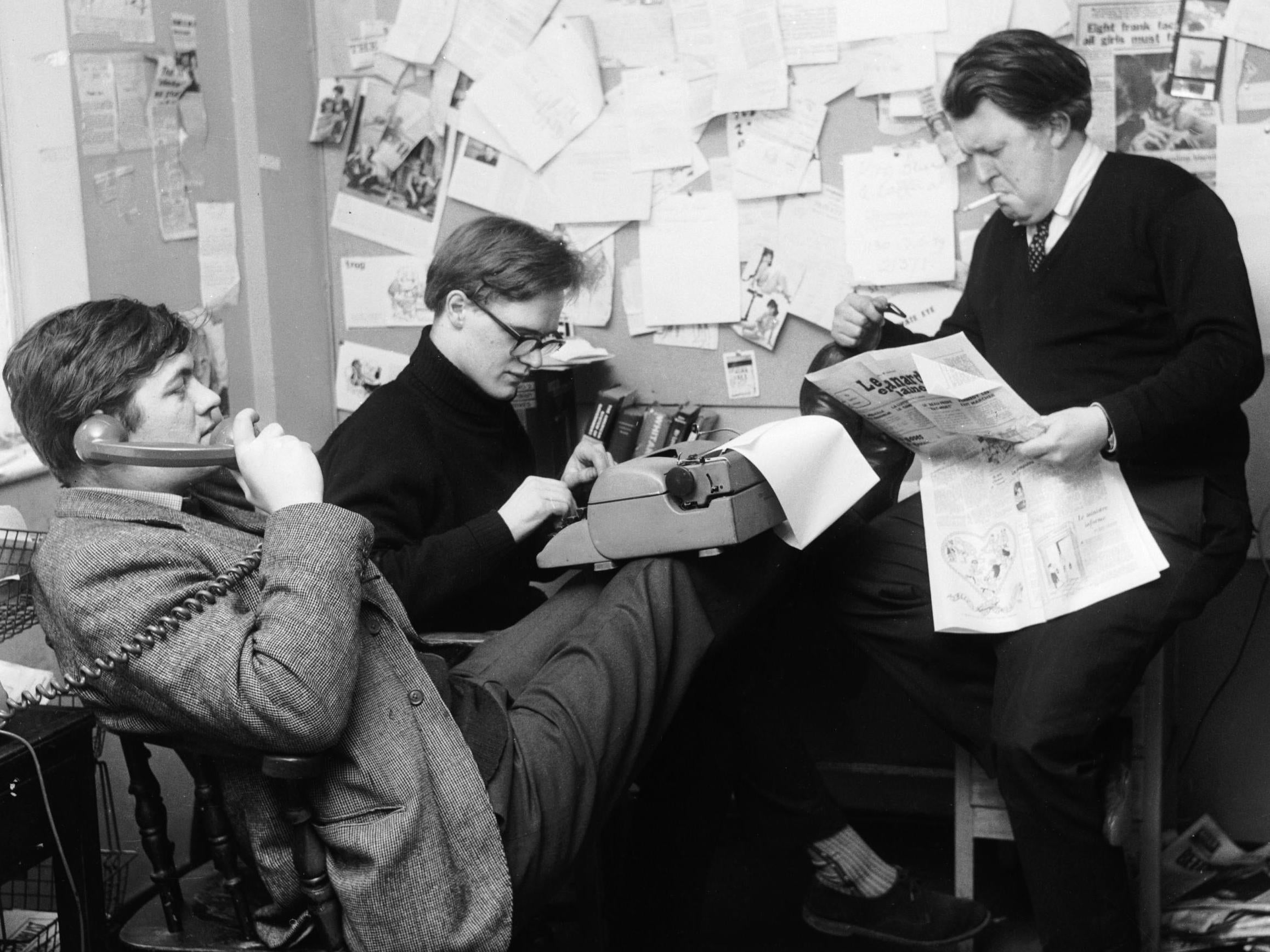 Booker (centre) with Richard Ingrams (left) and Willie Rushton in the office of ‘Private Eye’, 1963