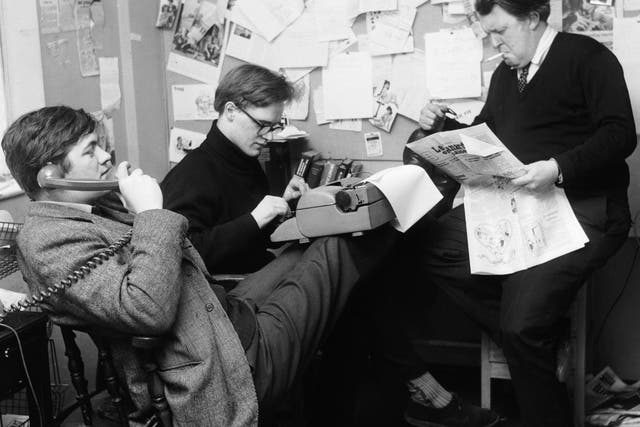 Booker (centre) with Richard Ingrams (left) and Willie Rushton in the office of ‘Private Eye’, 1963