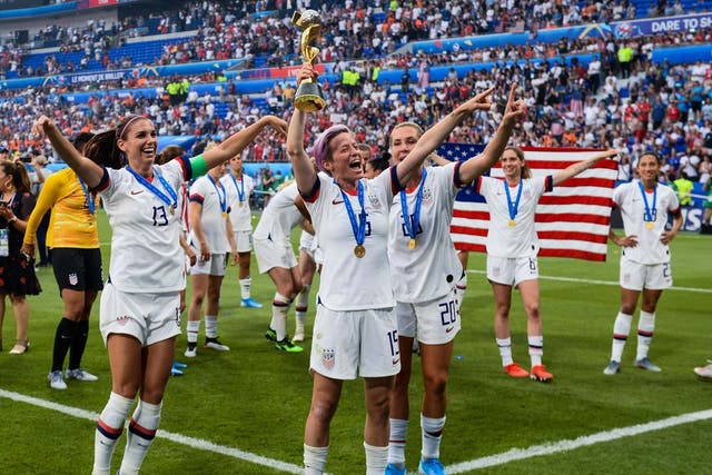 Megan Rapinoe leads the on-pitch celebrations after USA defeated Netherlands