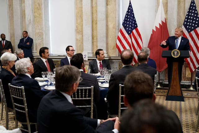 Trump speaks during a dinner in honour of the Qatar's emir