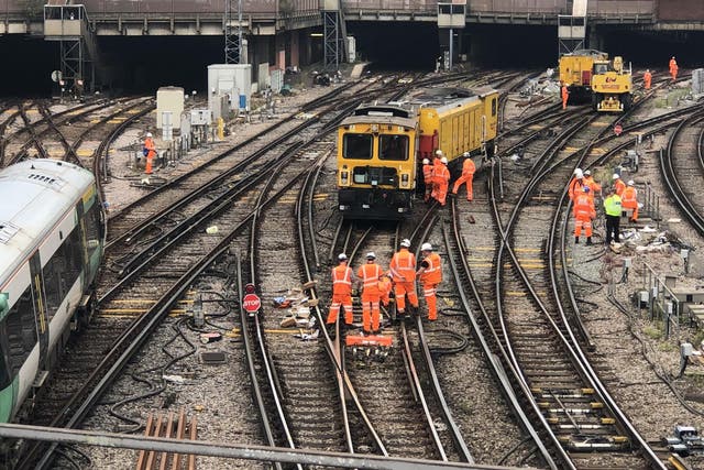 Line call: Network Rail engineers attempt to re-rail the engineering train