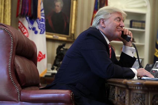 U.S. President Donald Trump speaks on the phone with Irish Prime Minister Leo Varadkar on the phone in the Oval Office of the White House June 27, 2017