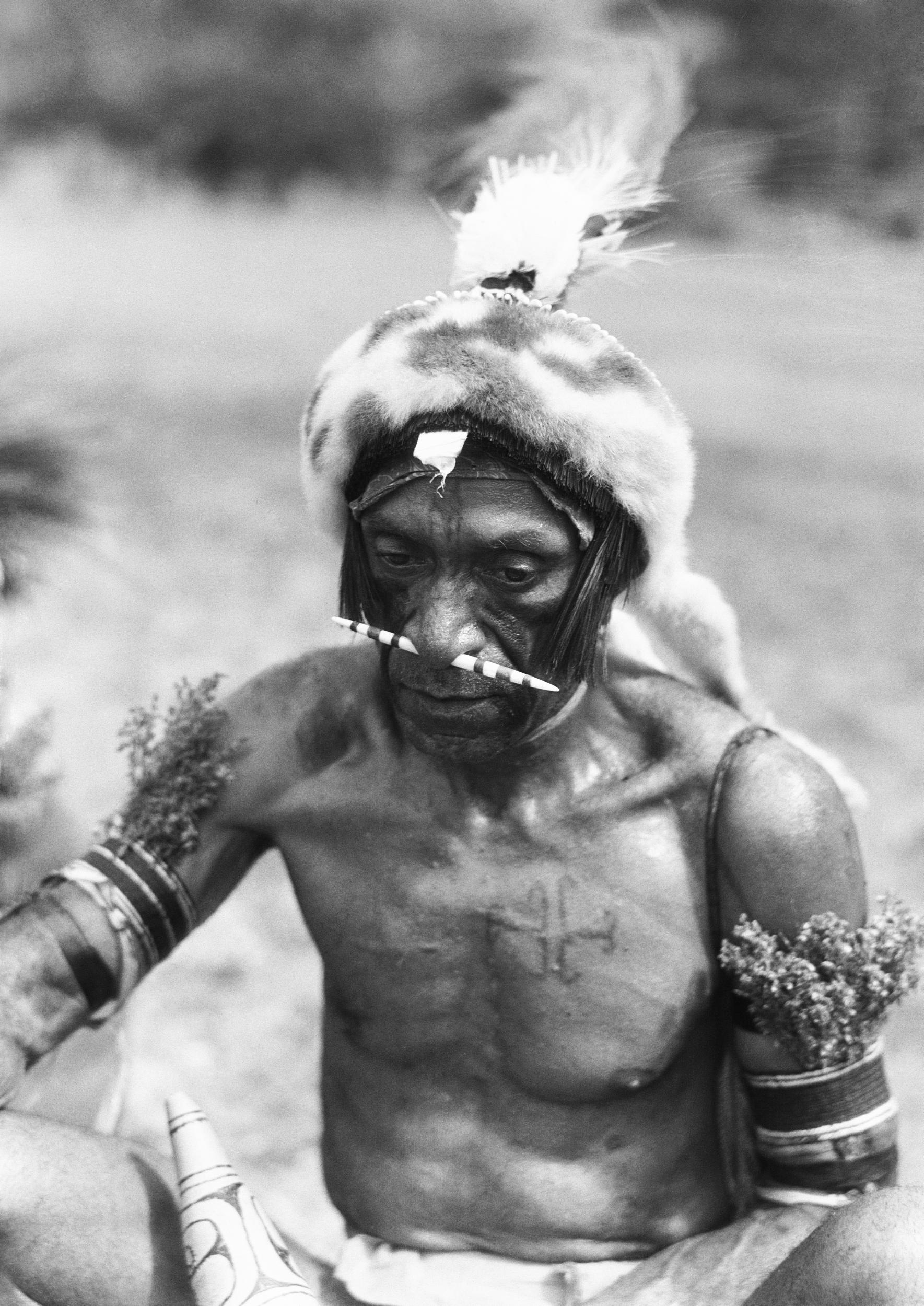 A native warrior is seen with bone through his nose, in 1930, at the neighbouring Port Moresby (Retrofile)