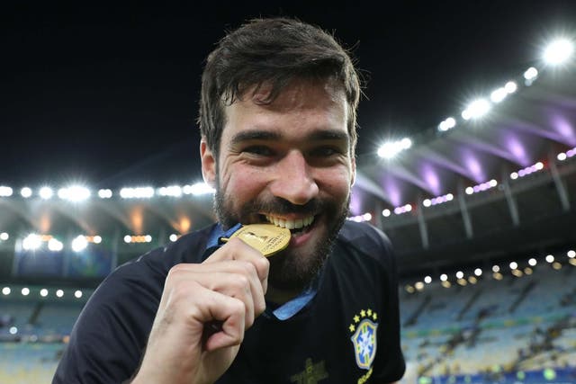 Alisson smiles after winning the Copa America