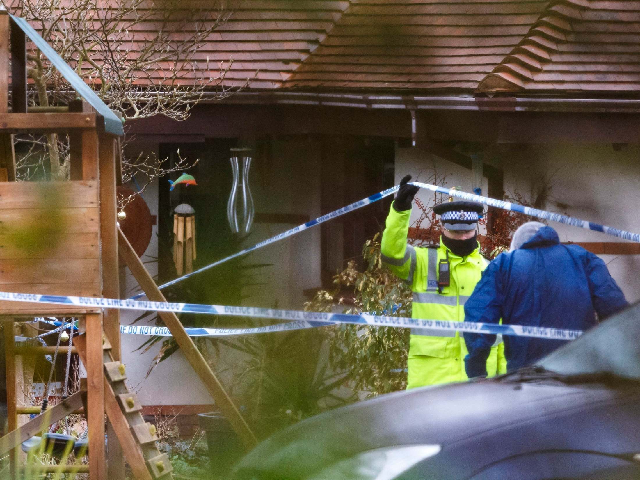 Police at a house where Valerie Graves was killed in December 2013, in Bosham, West Sussex