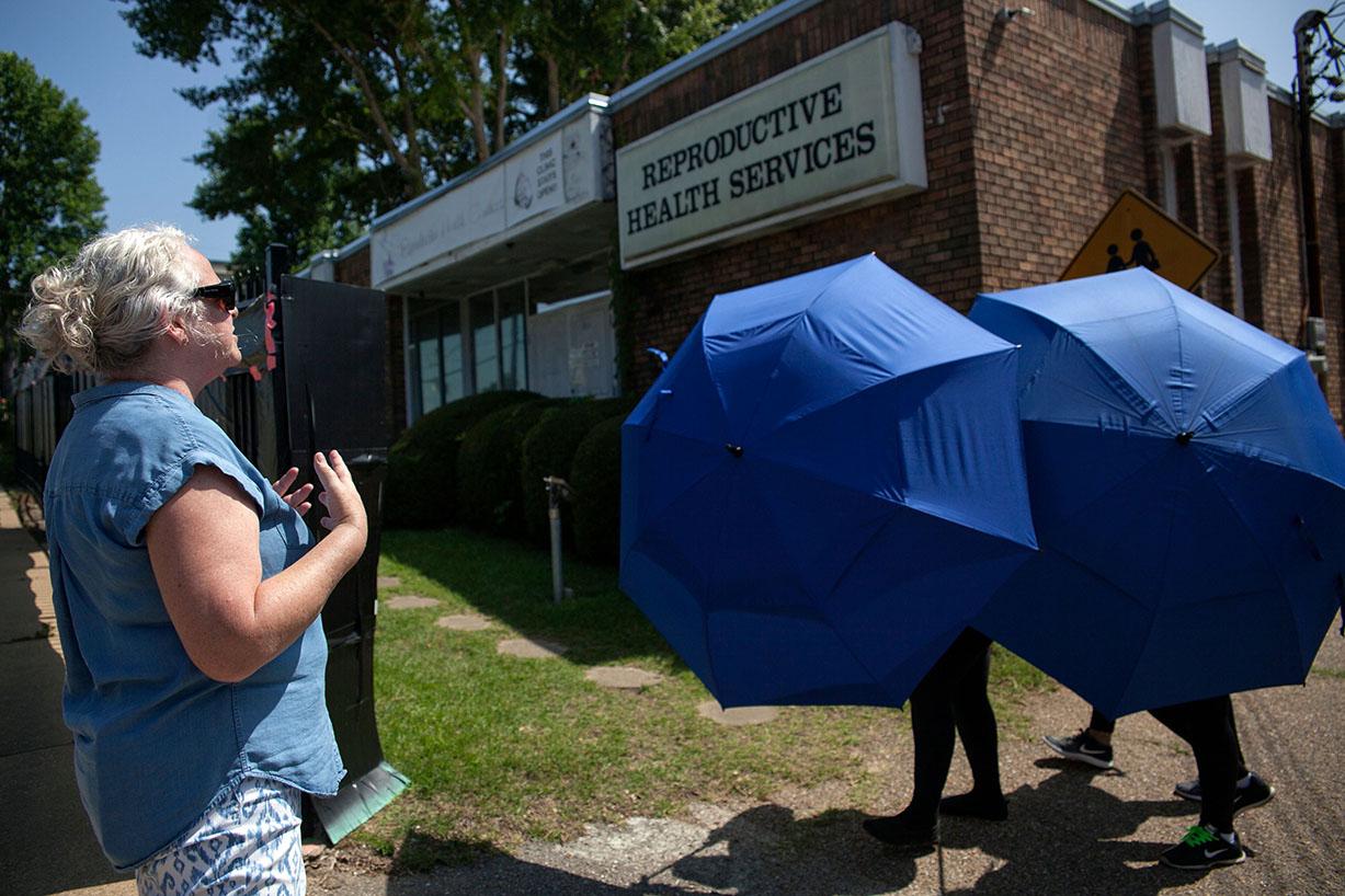 One of the ‘antis’ harangues a woman as she is escorted into the Reproductive Health Services building