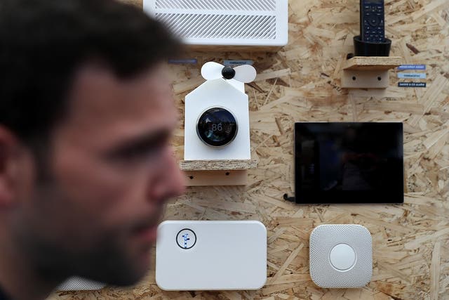An attendee passes a display of Nest products during Google I/O 2016 at Shoreline Amphitheatre on 19 May, 2016 in Mountain View, California