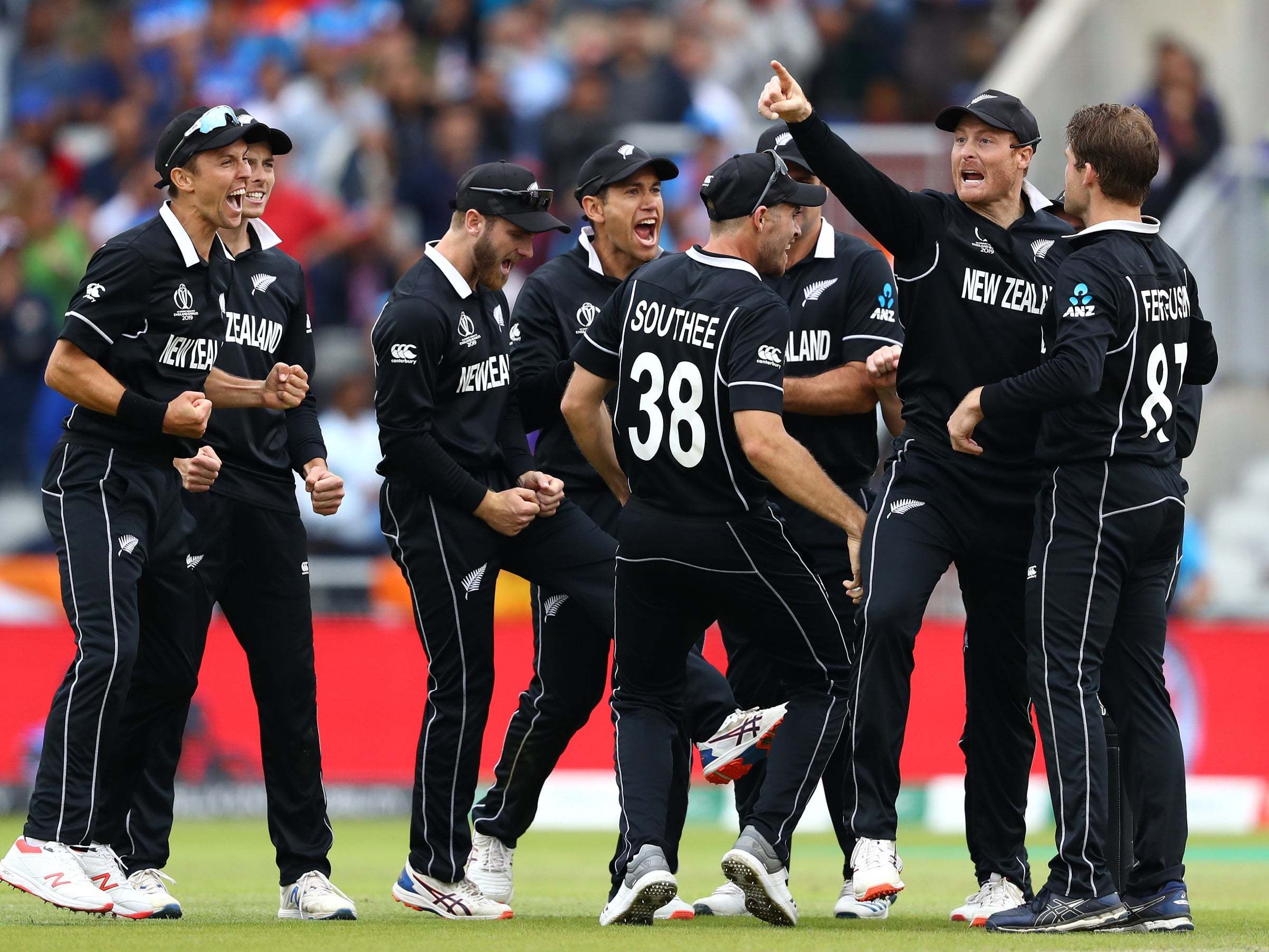 Martin Guptill celebrates his run-out of MS Dhoni