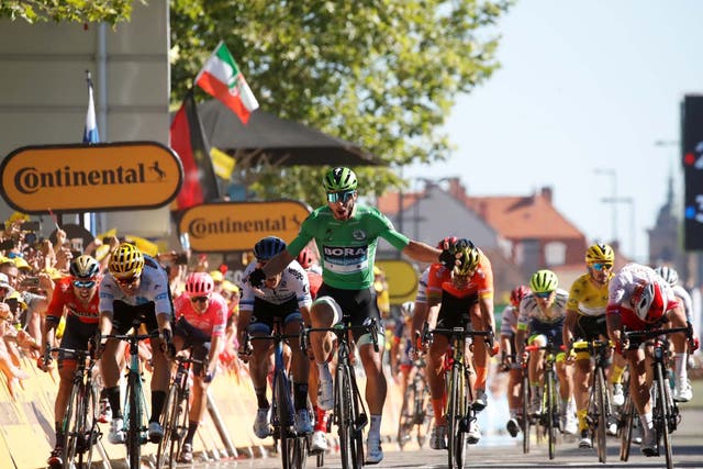 Peter Sagan dips over the finish line to clinch the stage victory