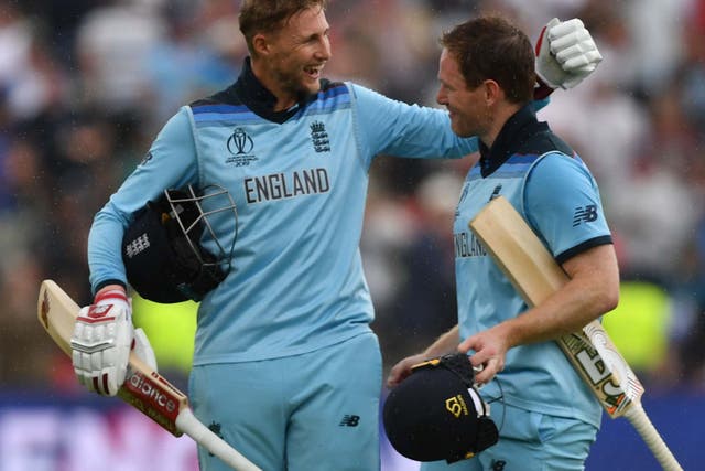 England's captain Eoin Morgan and Joe Root celebrate victory
