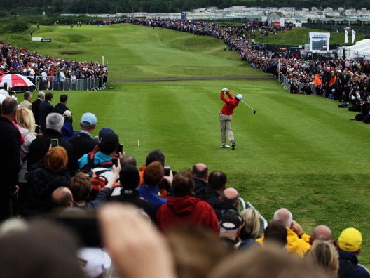 Rory McIlory tees off on the opening hole at Portrush