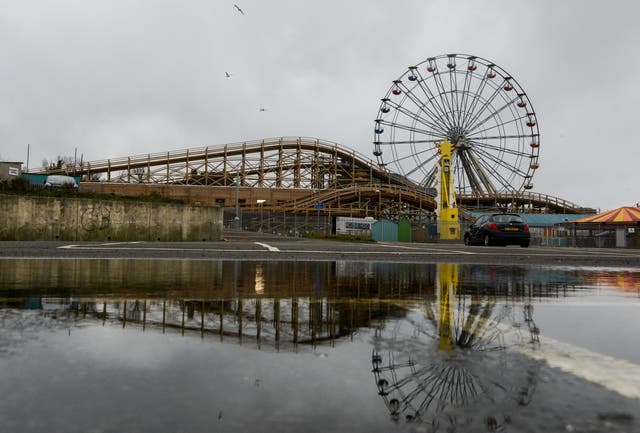 <p>A ferris wheel and the wooden rollercoaster, Scenic Railway, at Dreamland Margate</p>