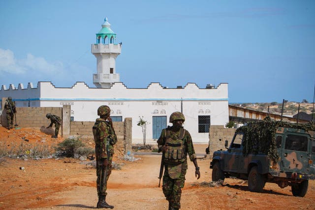Troops from the African Union Mission in Somalia patrol the city of Kismayo today, where a hotel attack by al-Shabaab left many dead