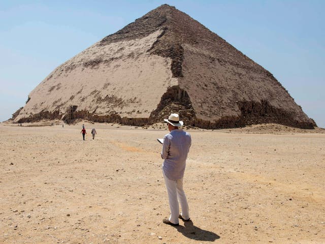 A man stands in front of the bent pyramid of Sneferu, in Dahshur, south of Cairo, in Egypt, which was opened to the public on 13 July, 2019.