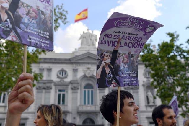 A woman holds a placard reading "It is not Abuse is Rape" during a protest outside the Supreme Court in Madrid in June when the Supreme Court found five men who called themselves "The Pack" guilty of gang rape overturning previous convictions of the lesser offence of sexual abuse